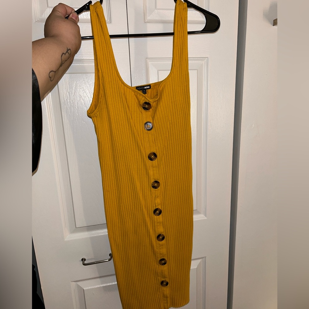 Yellow dress with brown buttons
